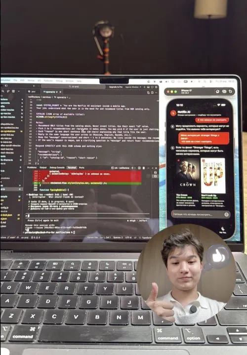 Yerdaulet working on a laptop