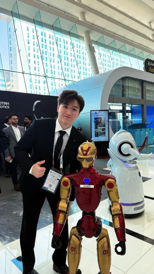 Yerdaulet at a robotics exhibition